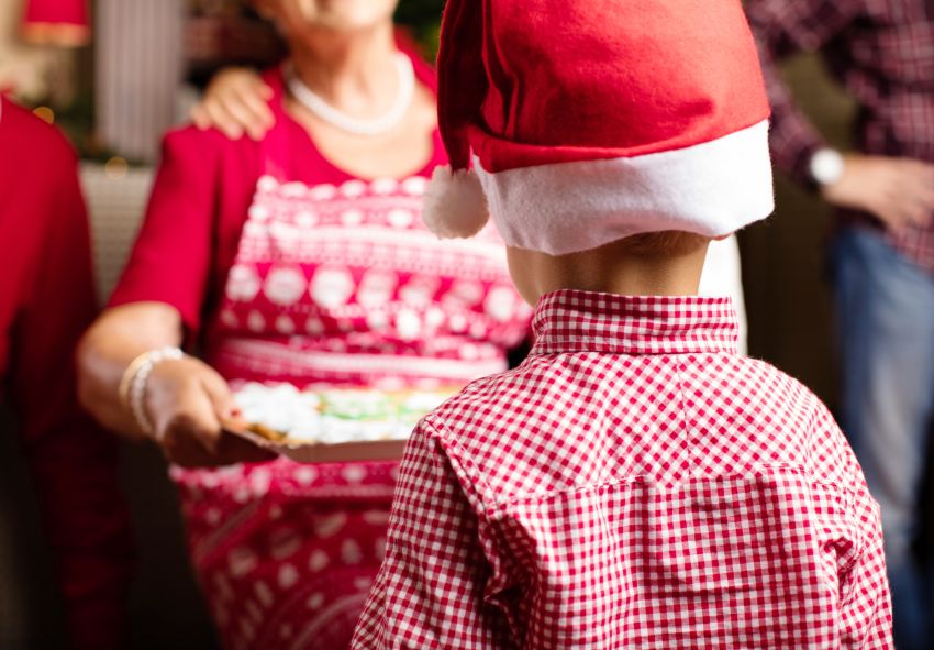 child back with santa claus hat christmas tradition 