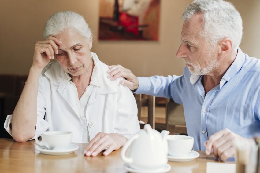 husband comforting upset perplexed wife 