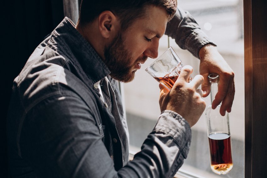 man drinker depressed with bottle alcohol 