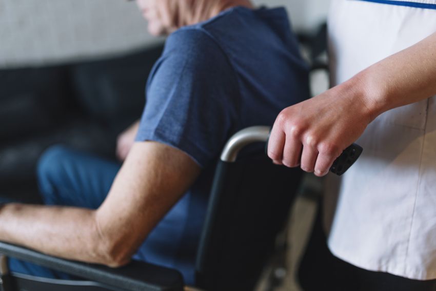 man wheelchair old age home 