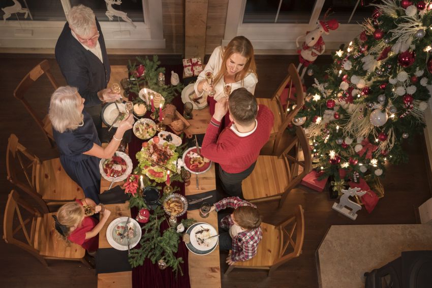 people enjoying festive christmas dinner together