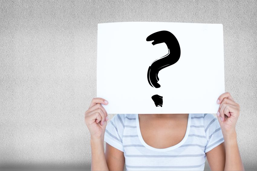 second guessing woman with sign face with question mark 