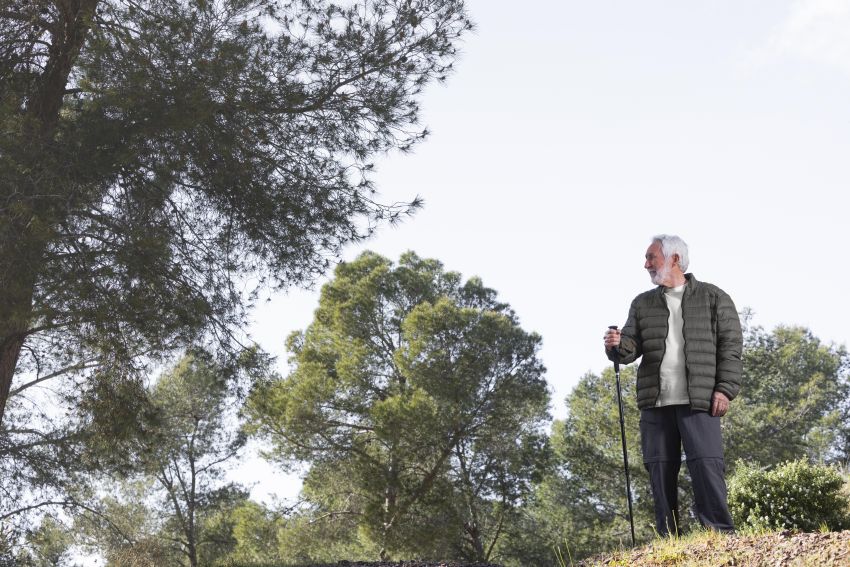 senior man hiking mountain wandering