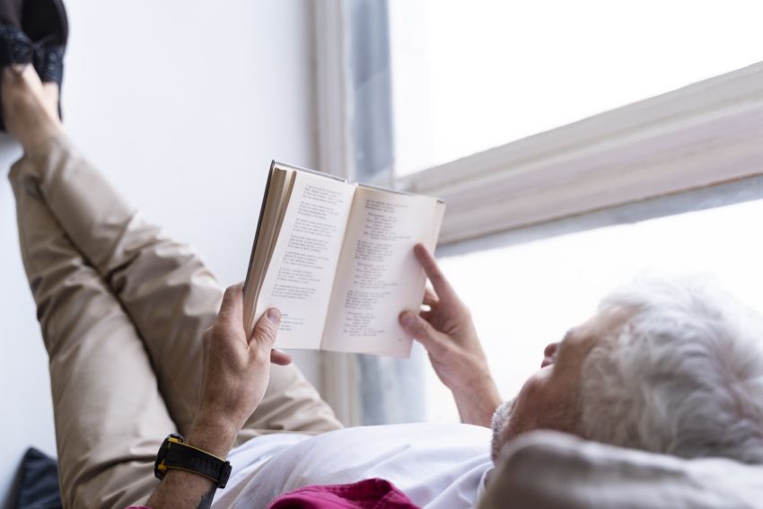 senior reading a book 