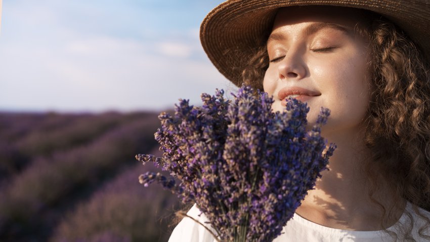 side view woman smelling lavender 