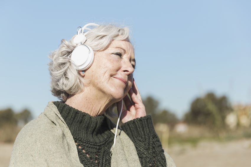 woman with headphones listening tto music